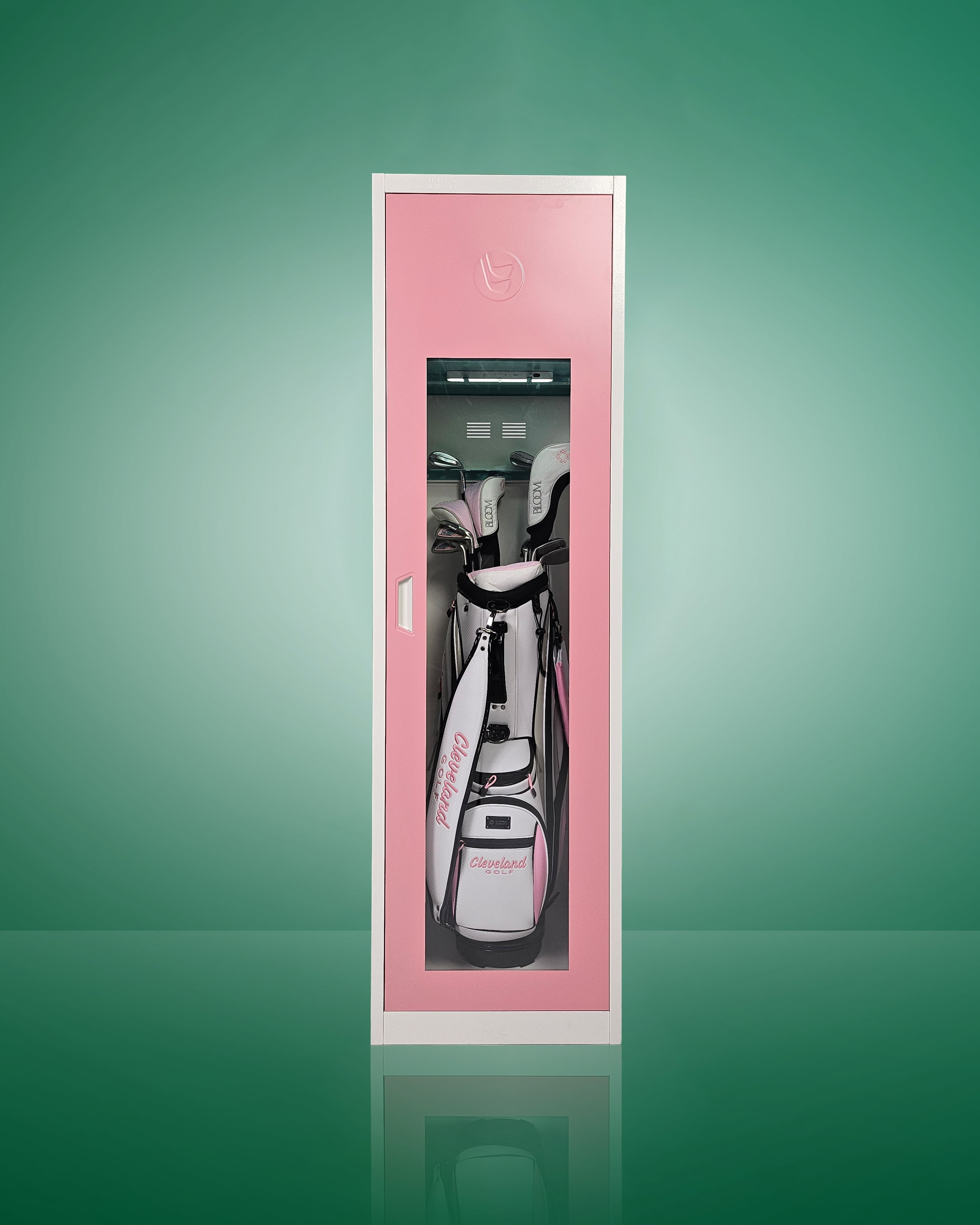 A pink golf bag storage locker with a clear acrylic window, showing golf clubs and equipment neatly organized inside.