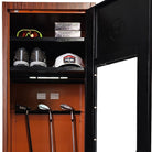 Golf locker with golf clubs, shoes, and a cap inside by Links Lockers home golf storage experts.